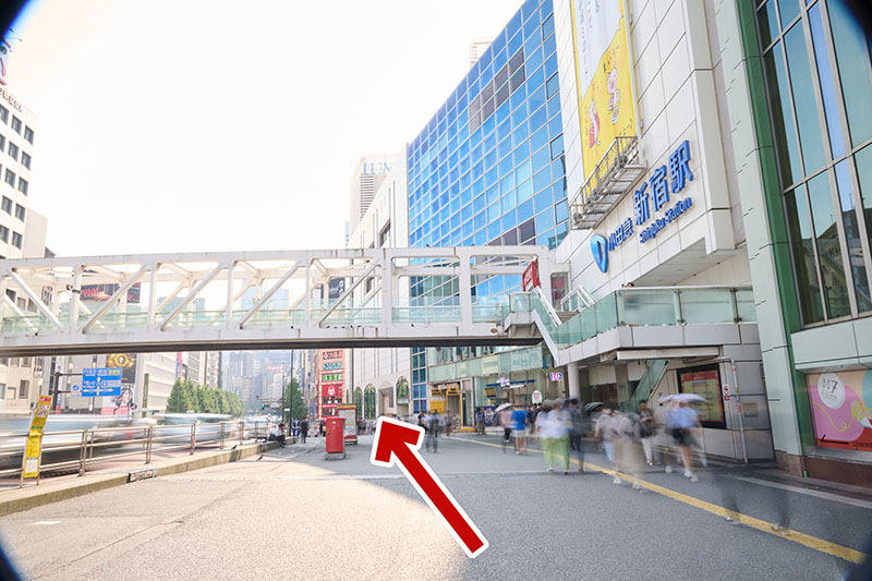 Walk straight along the sidewalk